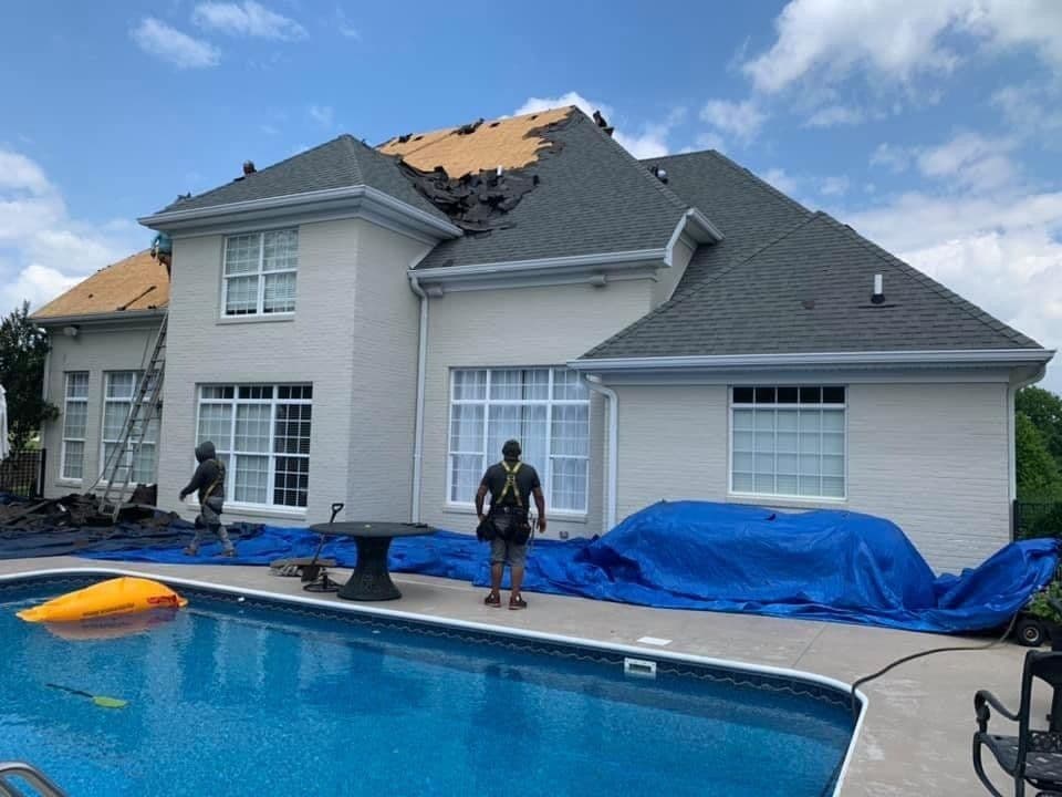 Emergency tarp installed on a storm-damaged roof